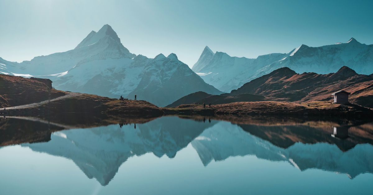 Stunning view of the Swiss Alps with clear reflections in Bachalpsee Lake.